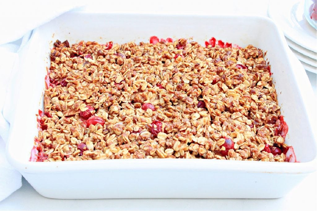 Cranberry Apple Crisp ~ You'll love this easy dessert that celebrates the flavors of fall with sweet apples, tart cranberries, seasonal spices, and a buttery oat topping!