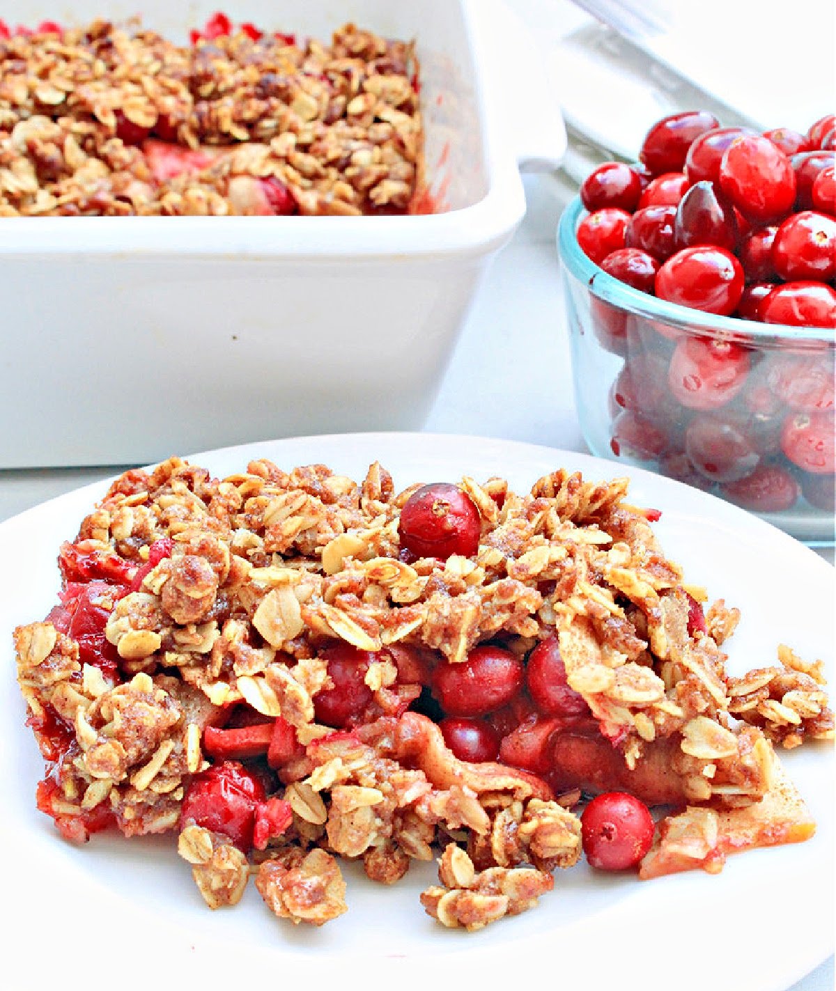 Cranberry Apple Crisp ~ You'll love this easy dessert that celebrates the flavors of fall with sweet apples, tart cranberries, seasonal spices, and a buttery oat topping!