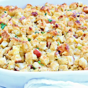 Vegan Cornbread Dressing ~ You're going to love this savory-sweet carb-forward side dish studded with celery, apples, and pecans. This plant-based holiday classic is the perfect addition to your Thanksgiving table!
