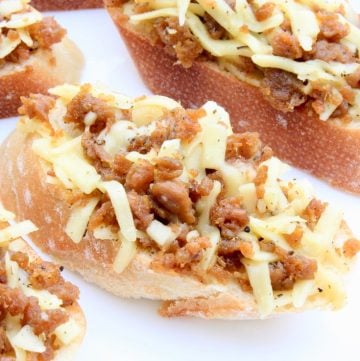 Italian Sausage Bruschetta ~ This savory appetizer delivers big flavors with simple ingredients! Great for holidays, parties, and game days!