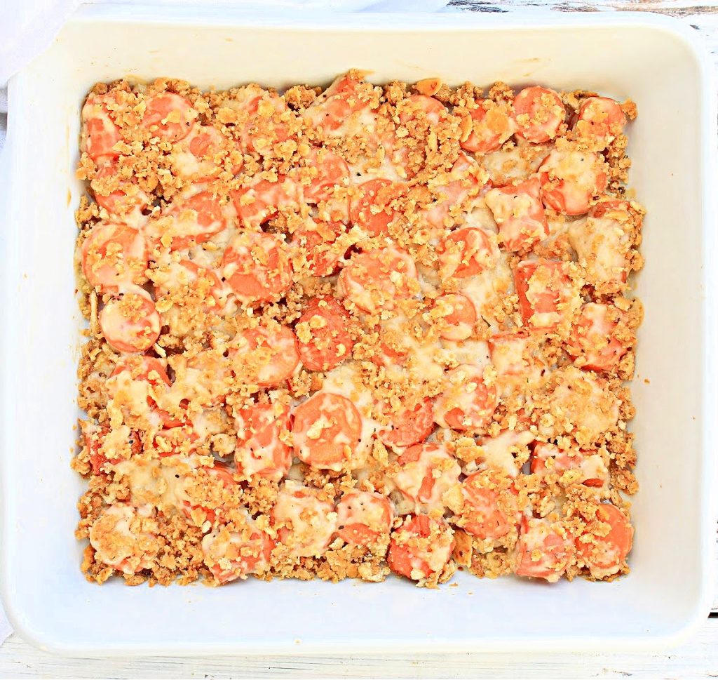 Carrots Au Gratin ~ Naturally sweet carrots baked in a creamy cheese sauce and sprinkled with a buttery cracker crumb topping. This cheesy carrot casserole makes a delicious addition to your holiday menu!