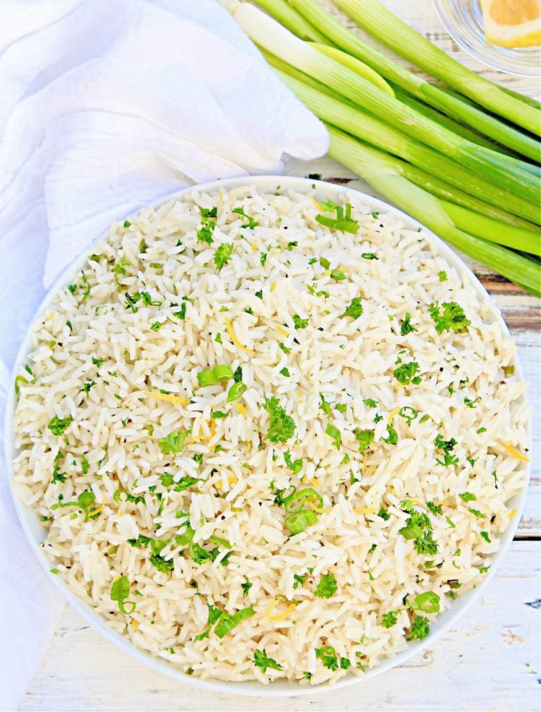 Herbed Rice ~ Fluffy white rice is elevated with the flavors of fresh herbs, simple seasonings, and a hint of lemon. Easy to make and pairs well with a variety of cuisines!