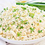 Herbed Rice ~ Fluffy white rice is elevated with the flavors of fresh herbs, simple seasonings, and a hint of lemon. Easy to make and pairs well with a variety of cuisines!