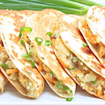 Potato Tacos (Tacos de Papa) ~ Mexican-spiced mashed potatoes wrapped in tortillas and lightly fried to golden perfection. An easy and budget-friendly taco dinner!