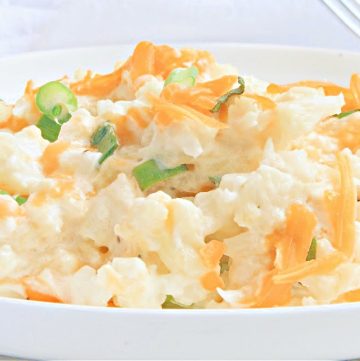 Mashed Cauliflower Casserole ~ Cauliflower smashed to a chunky consistency and then baked in creamy, dairy-free cheese sauce for an easy and flavorful side dish. Perfect for holidays or everyday dinners!