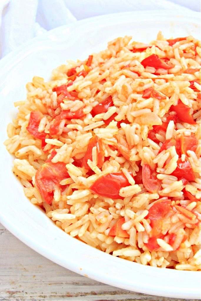 Southern Tomatoes and Rice ~ Juicy, fresh-from-the-garden tomatoes and sweet Vidalia onion, simmered with white rice and a handful of simple ingredients, bring old-fashioned Southern flair to the dinner table!