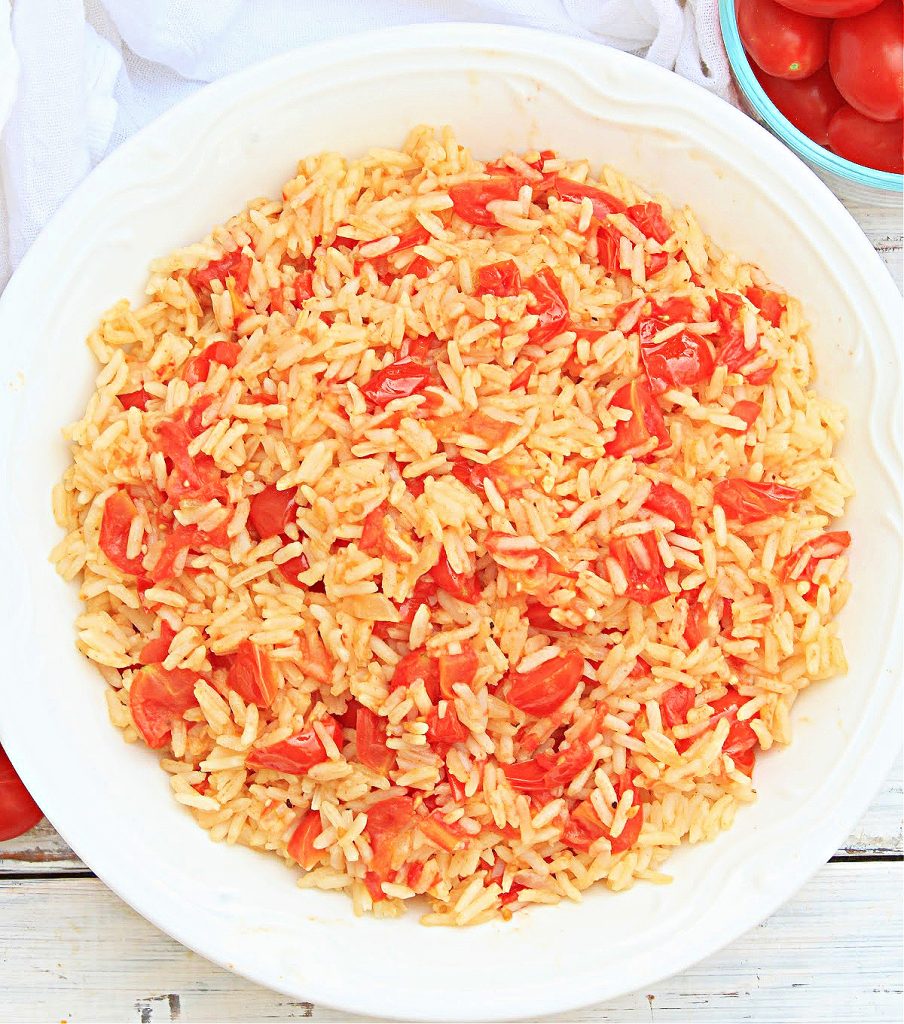 Southern Tomatoes and Rice ~ Juicy, fresh-from-the-garden tomatoes and sweet Vidalia onion, simmered with white rice and a handful of simple ingredients, bring old-fashioned Southern flair to the dinner table!