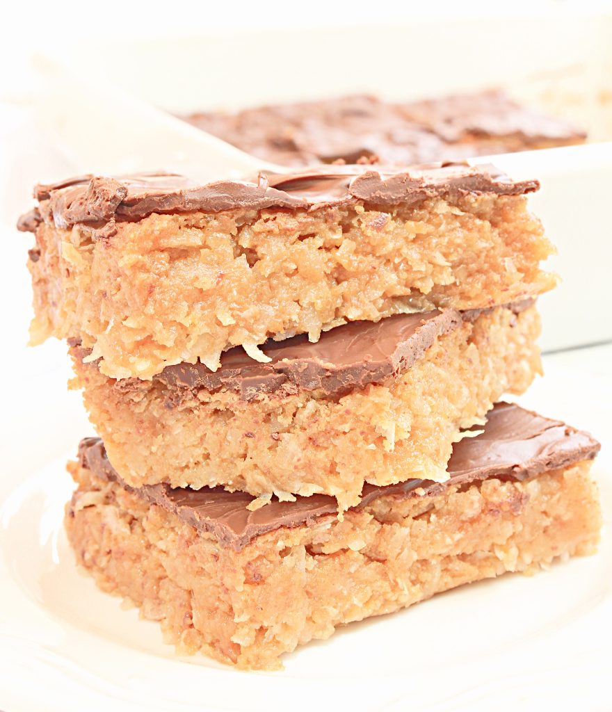 Chocolate Covered Coconut Bars ~ A chewy and buttery mixture of graham cracker crumbs, shredded coconut, and sweetened condensed coconut milk topped with a luscious layer of melted chocolate.