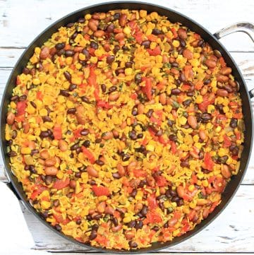 Yellow Rice and Beans with Vegetables ~ Serve this savory dish with black and pinto beans, seasoned rice, and vegetables as a hearty side dish or main course.