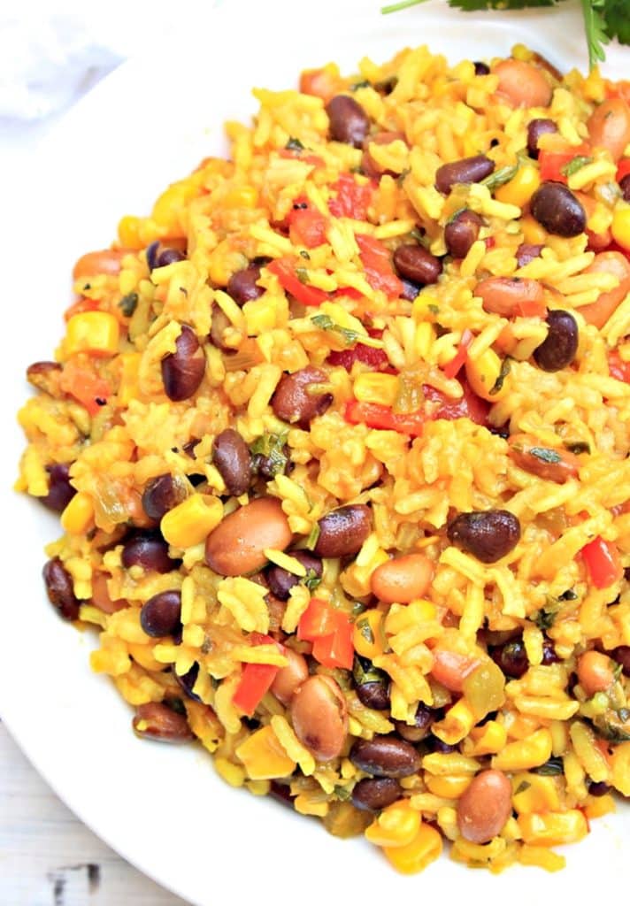 Yellow Rice and Beans with Vegetables ~ Serve this savory dish with black and pinto beans, seasoned rice, and vegetables as a hearty side dish or main course.