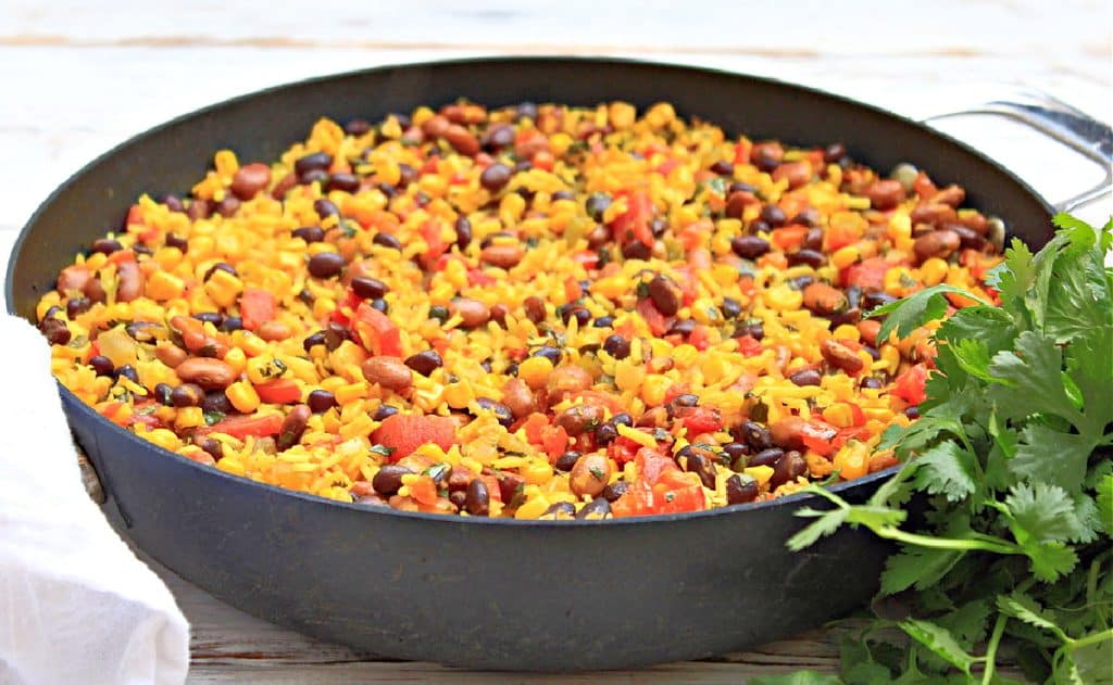 Yellow Rice and Beans with Vegetables ~ Serve this savory dish made with black and pinto beans, seasoned rice, and vegetables as a hearty side dish or main course.