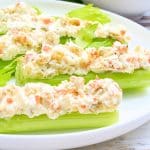 Crisp celery stuffed with a simple and savory mixture of cream cheese and olives. Serve as a low-carb snack or holiday appetizer!