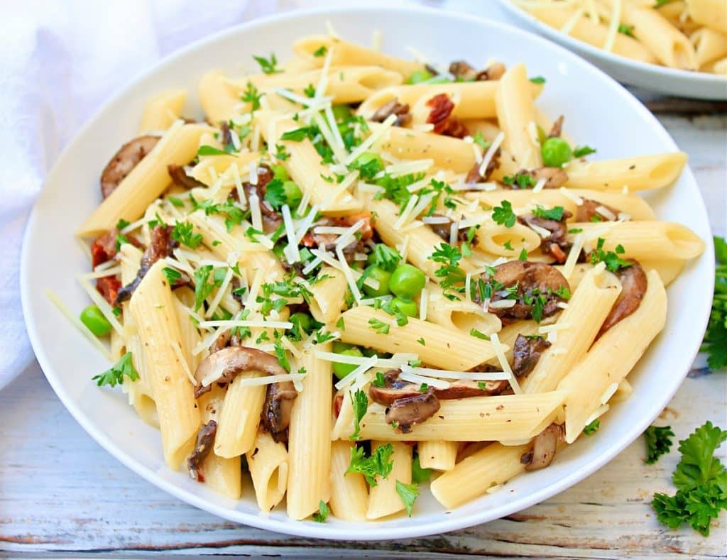 Pasta with Mushrooms and Peas ~ This rich and creamy one-pot pasta dinner is easy to make and loaded with savory flavors!