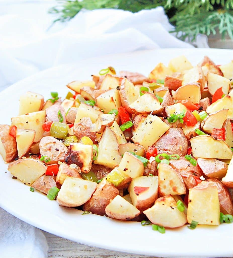 Breakfast Potatoes ~ Oven-roasted red potatoes with bell peppers and simple seasonings are an easy, flavorful, and budget-friendly side dish any time of day!