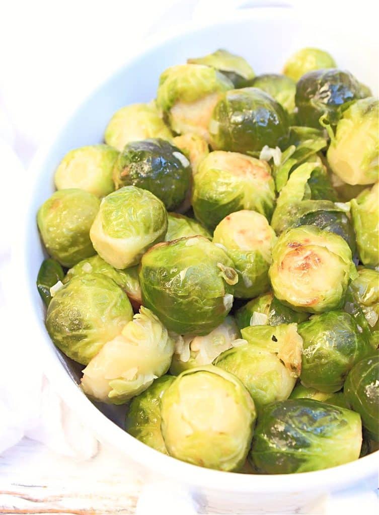 Pan-fried Brussels sprouts simmered in a savory and buttery plant-based broth are easy, flavorful, and versatile! Sprinkle with dried cranberries and toasted walnuts for extra holiday flair!