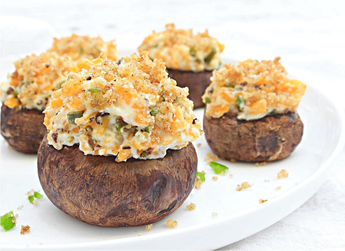 Jalapeno Popper Stuffed Mushrooms ~ Baked mushrooms stuffed with creamy dairy-free cheeses, jalapeno pepper, and buttery breadcrumb topping. Serve as an easy holiday appetizer or game day snack!