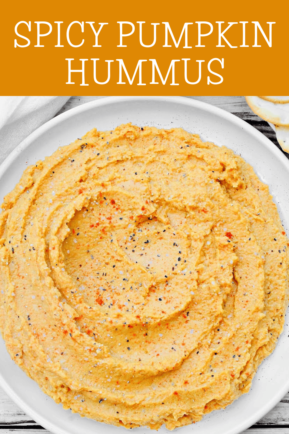 Pumpkin Hummus Recipe ~ Homemade pumpkin hummus is easy to make and loaded with smoky, savory autumn flavors with a spicy kick! via @thiswifecooks