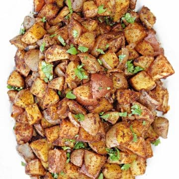 Mexican Potatoes ~ An easy, budget-friendly side dish of crisp roasted potatoes seasoned with a savory blend of spices.