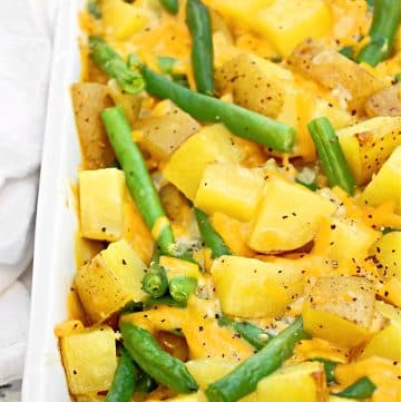 Green Bean and Potato Casserole ~Fresh green beans and hearty potatoes baked in a savory cheese sauce.