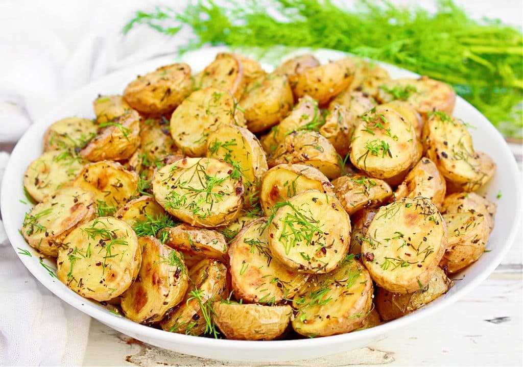 Roasted Dill Potatoes ~ Lightly crisp on the outside, tender on the inside, and rich with the flavors of butter, garlic, and fresh dill!