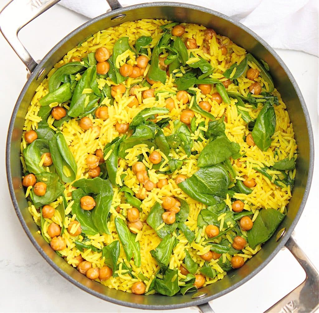 Chickpea Rice Pilaf ~ Easy recipe for savory turmeric-infused rice studded with fresh spinach and roasted chickpeas.