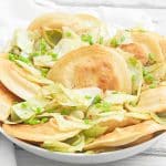 Pierogies and Cabbage ~ Pan-fried pierogies with caramelized cabbage and onions. This one-skillet meal is ready to serve in just 30 minutes!