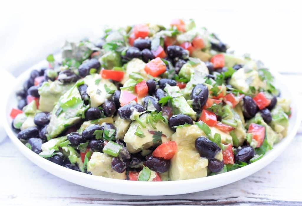 Black Bean Avocado Salad ~ Creamy avocado, protein-packed black beans, crisp peppers, fresh herbs, and tangy lime dressing. This refreshing and healthy salad is easy to make and perfect as a side dish or light lunch!