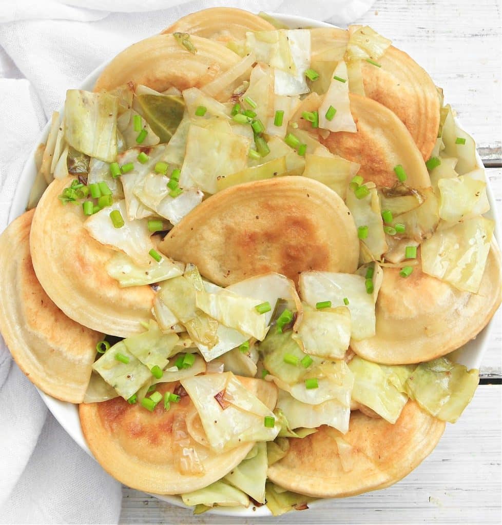 Pierogies and Cabbage ~ Pan-fried pierogies with caramelized cabbage and onions. This one-skillet meal is ready to serve in just 20 minutes!