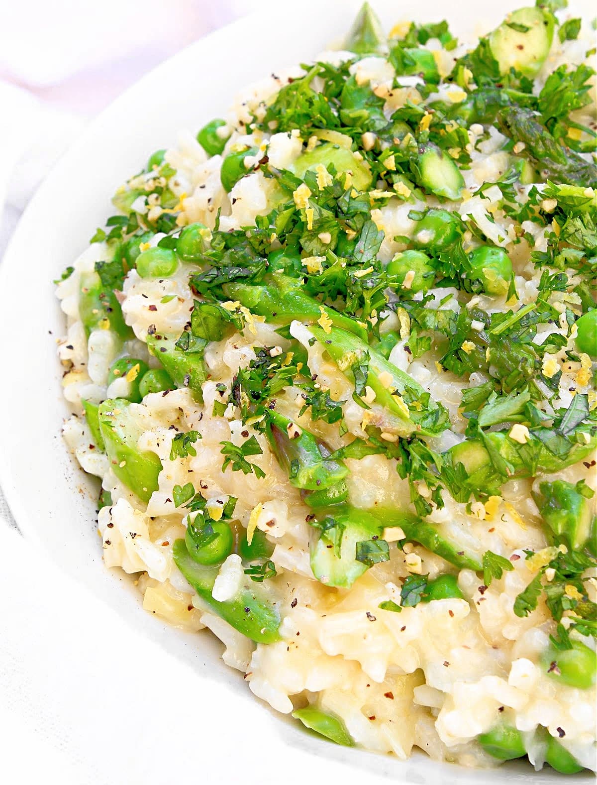 Spring Risotto ~ Bright spring vegetables and creamy risotto topped with garden-fresh herbs. Perfect for Easter and springtime gatherings!