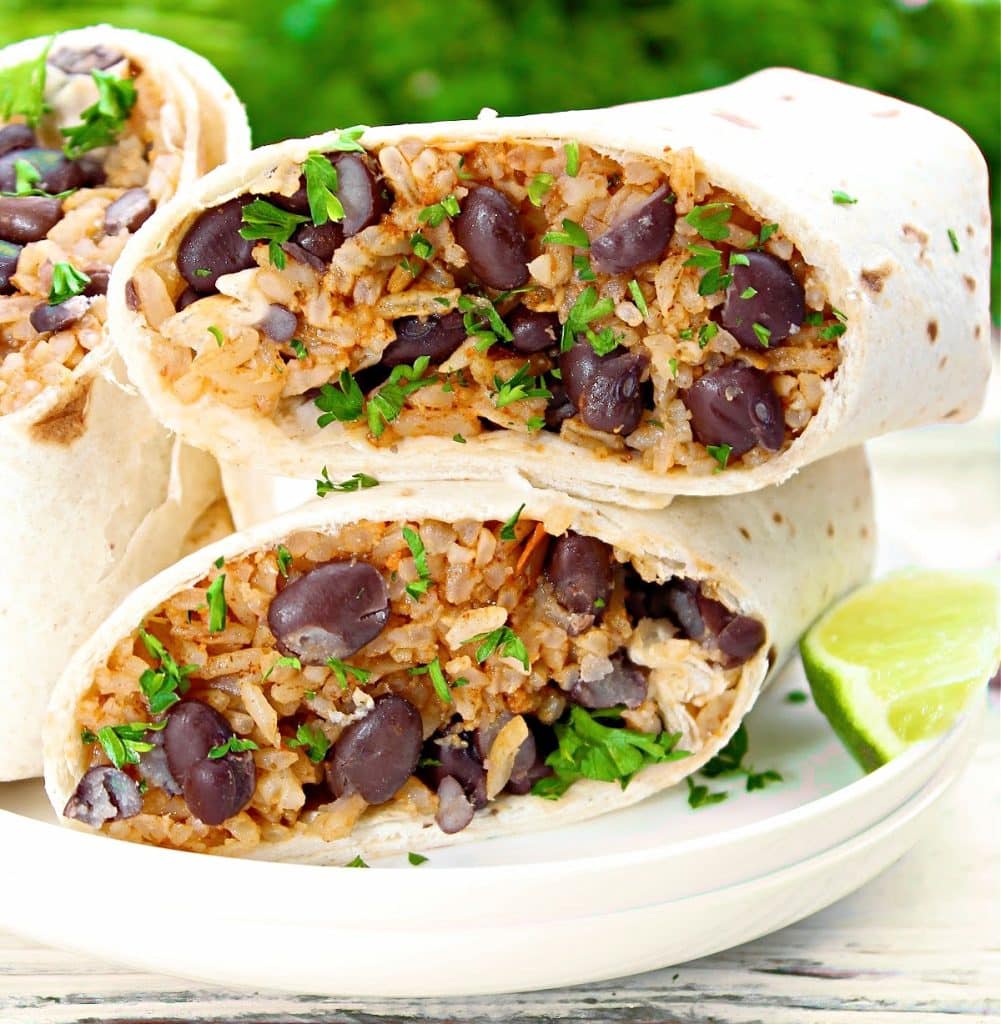 Rice and Bean Burritos ~ Taco-seasoned rice and protein-packed black beans wrapped in flour tortillas for a quick and easy lunch or dinner. These freezer-friendly wraps are also perfect for meal prep!