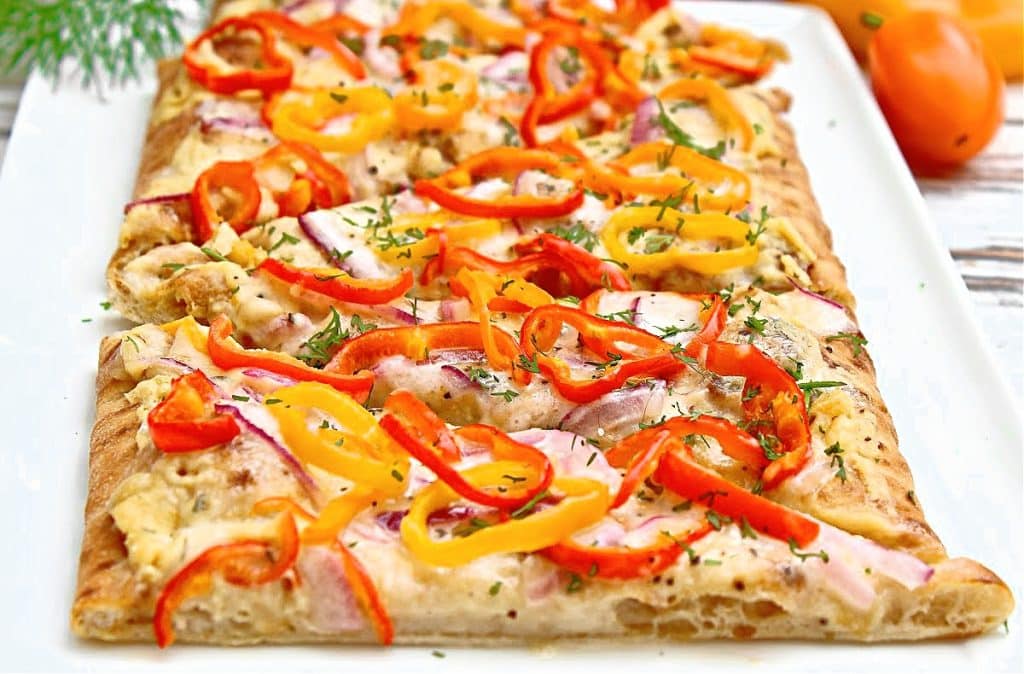 Bring Mediterranean flair to pizza night with layers of savory hummus, colorful sweet peppers, and dairy-free feta cheese. This quick and easy dinner is ready to serve in 20 minutes or less.