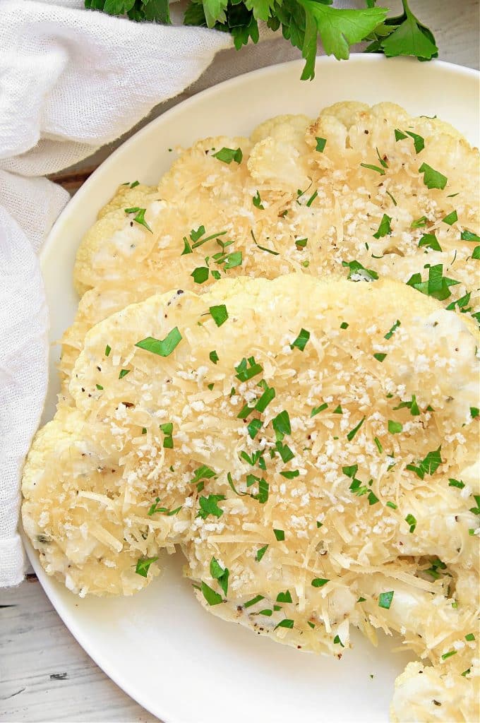 Cauliflower Steak Au Gratin ~ Savory roasted cauliflower generously layered with dairy-free Boursin and Parmesan cheeses and sprinkled with breadcrumbs.