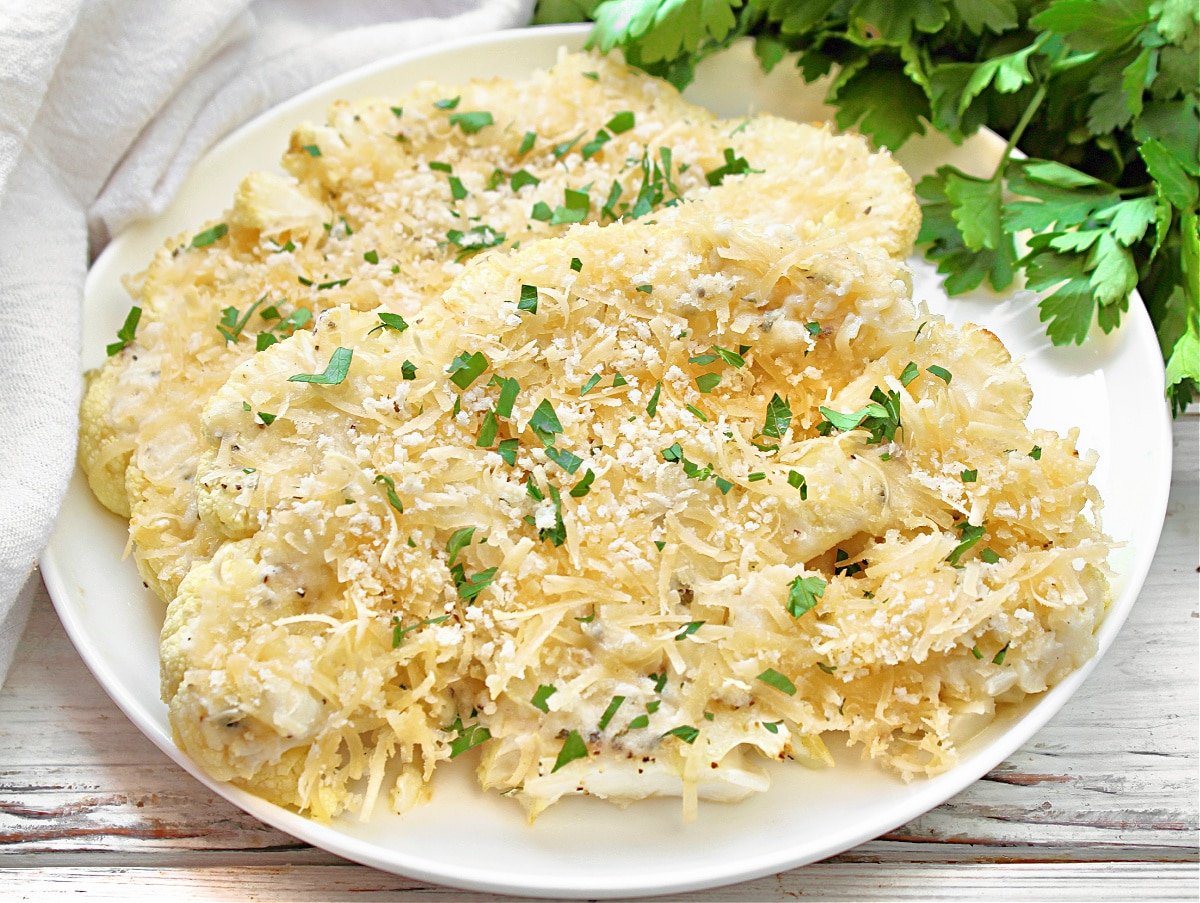 Cauliflower Steak Au Gratin ~ Savory roasted cauliflower generously layered with dairy-free Boursin and Parmesan cheeses and sprinkled with breadcrumbs.