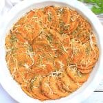 Pesto Sweet Potatoes ~ Thinly sliced sweet potatoes tossed in basil pesto and Parmesan cheese. Perfect for Thanksgiving or Christmas dinner!