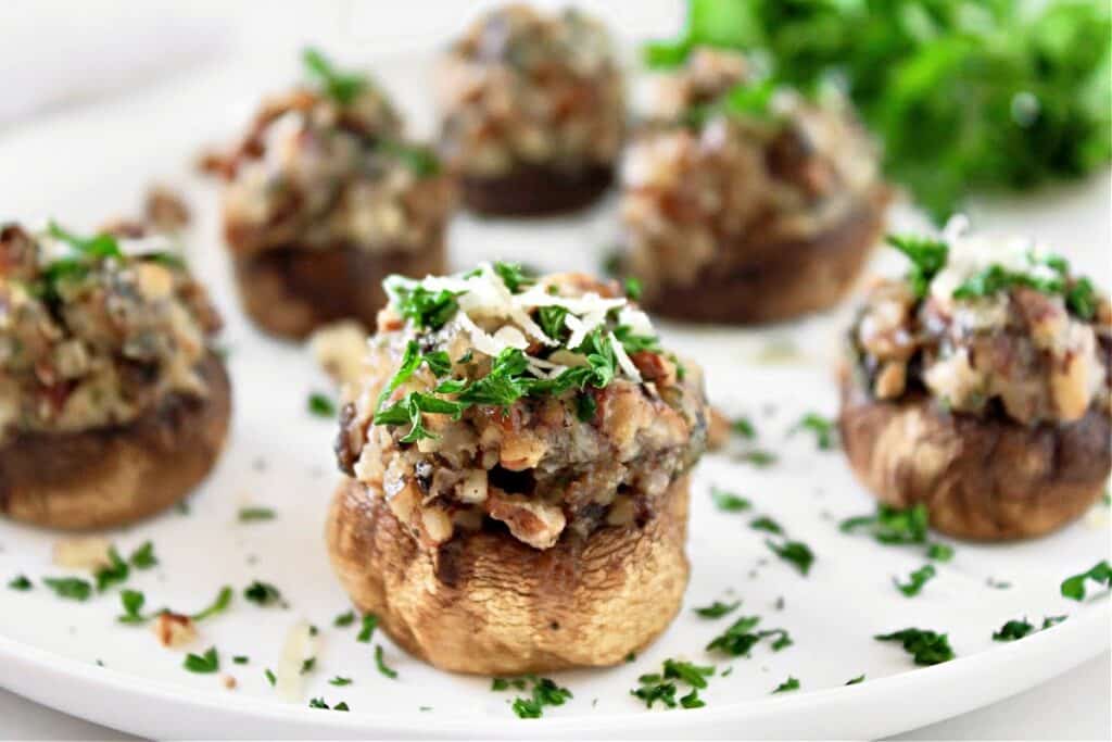 Pecan Stuffed Mushrooms ~ Bite-size vegan or vegetarian appetizer with a savory blend of earthy mushrooms and rich, nutty flavor.
