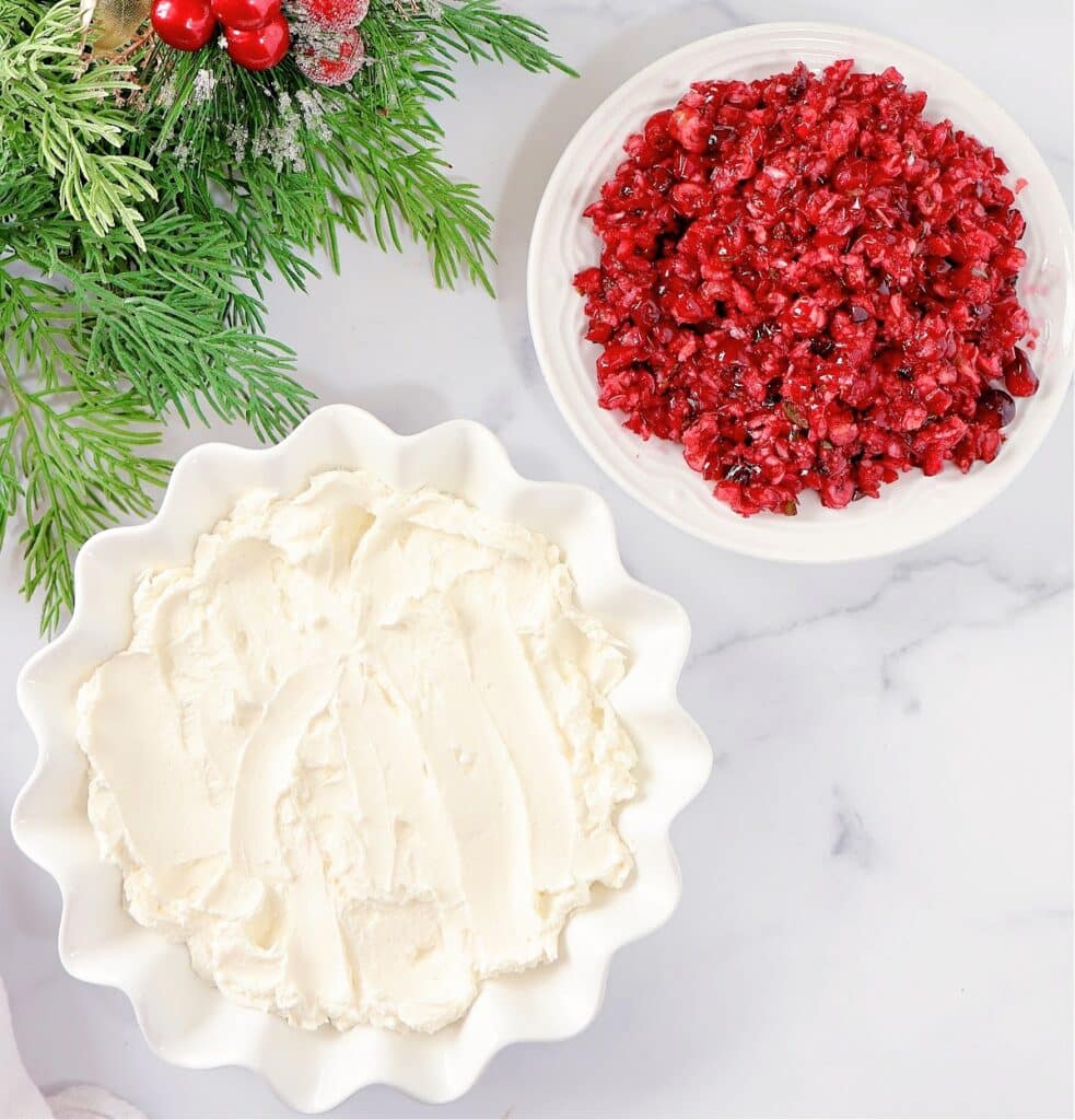 How to Make Cranberry Cream Cheese Dip ~ Whipped cream cheese topped with fresh cranberry salsa is the perfect holiday appetizer! Make it vegan or vegetarian.