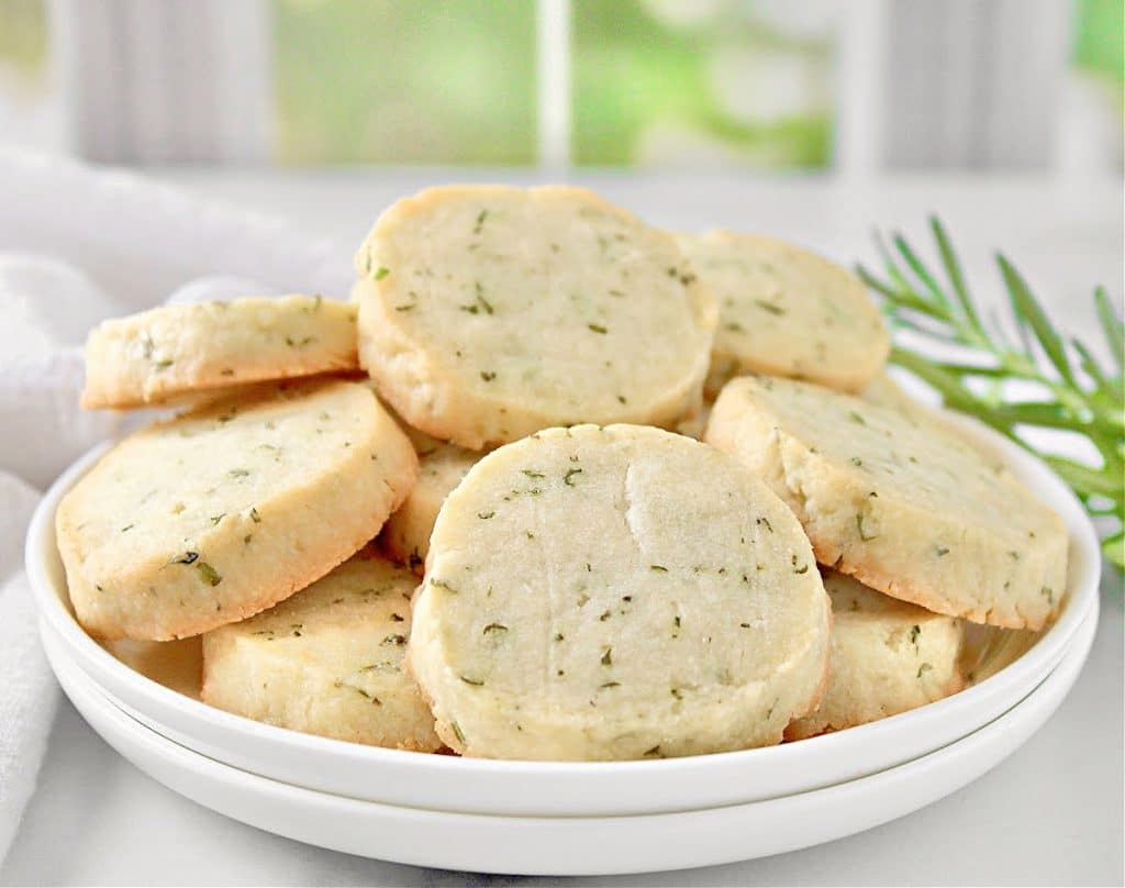 Rosemary Cookies ~ Deliciously buttery shortbread cookies studded with fresh rosemary. Easy to make perfect as a savory treat with hot tea!