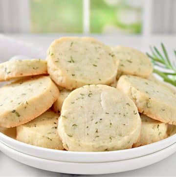 Rosemary Cookies ~ Deliciously buttery shortbread cookies studded with fresh rosemary. Easy to make perfect as a savory treat with hot tea!