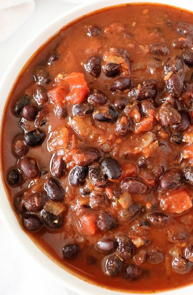 Black Bean Chili ~ A hearty and satisfying plant-based chili ready in 30 minutes or less! Ideal for chilly nights or game day get-togethers.