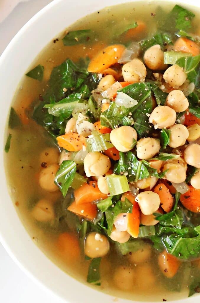 A quick and flavorful soup featuring tender chickpeas, vibrant collard greens, and aromatic spices in a savory broth. Ready in just 20 minutes, it's a wholesome and time-friendly choice for a delicious and comforting meal.