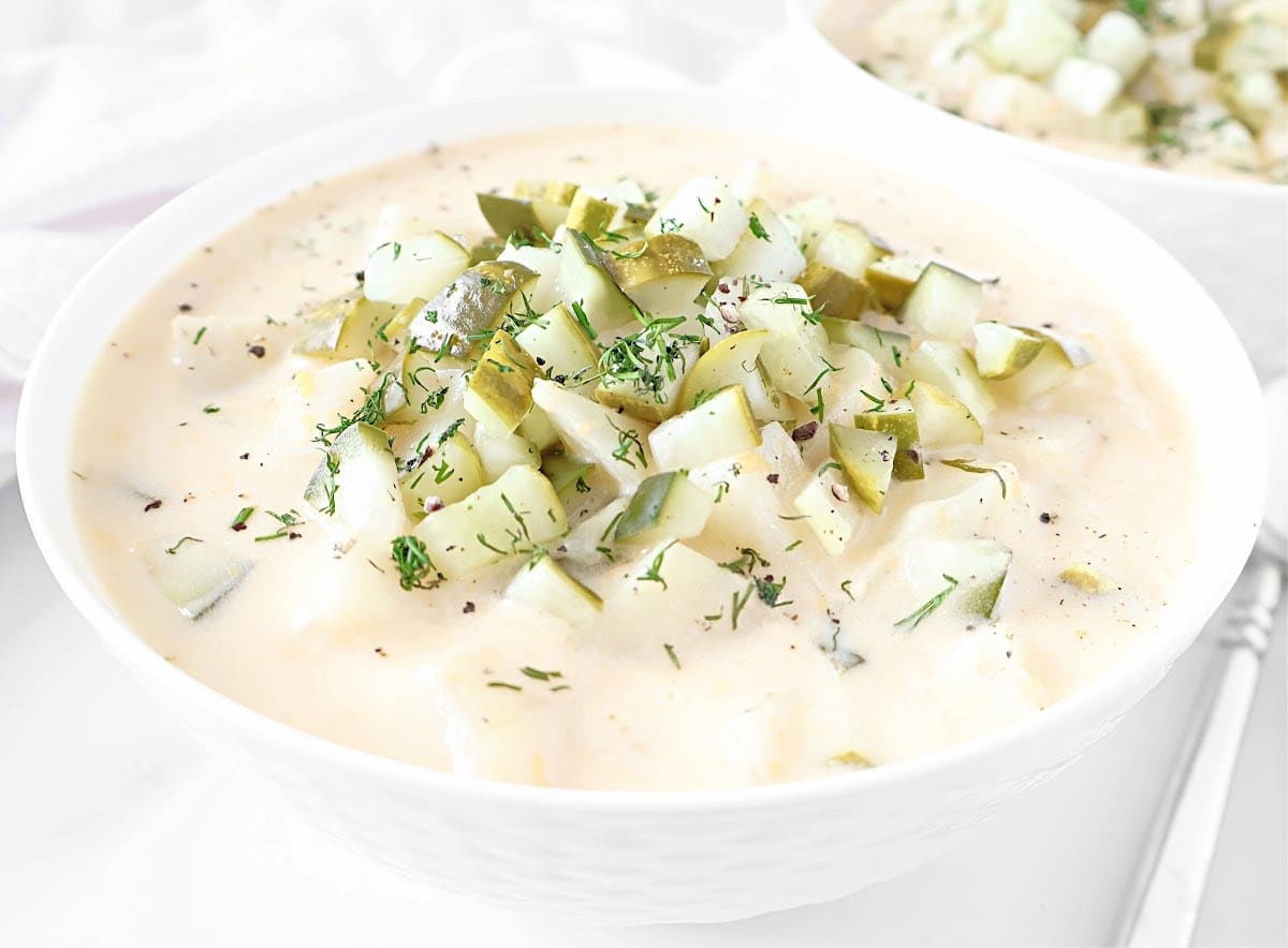 Dill Pickle Potato Soup ~ A cozy blend of creamy potatoes, tangy pickles, and melty cheddar cheese. Ready in 30 minutes or less!