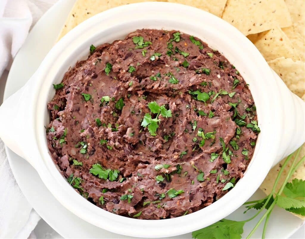 Black Bean Dip ~ Quick and easy dip with hearty black beans, zesty lime juice, simple seasonings, and fresh cilantro. Ready in 10 minutes.