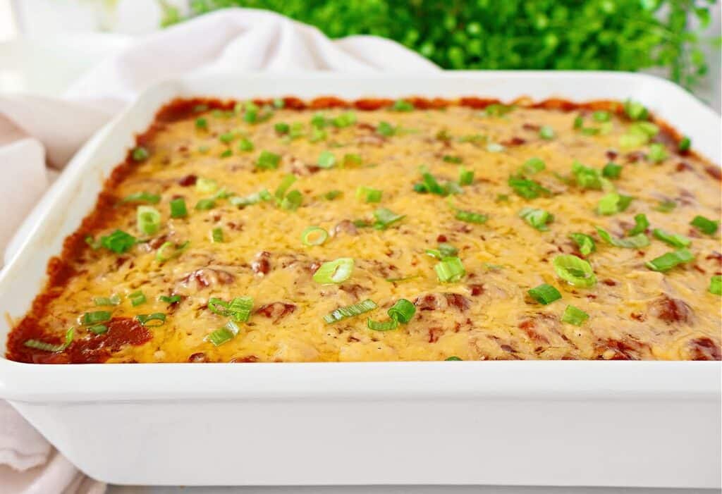 Polenta Chili Casserole ~ Creamy polenta, hearty chili, and melted cheese in an easy and comforting casserole. Vegetarian and Vegan.