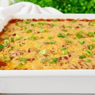 Polenta Chili Casserole ~ Creamy polenta, hearty chili, and melted cheese in an easy and comforting casserole. Vegetarian and Vegan.