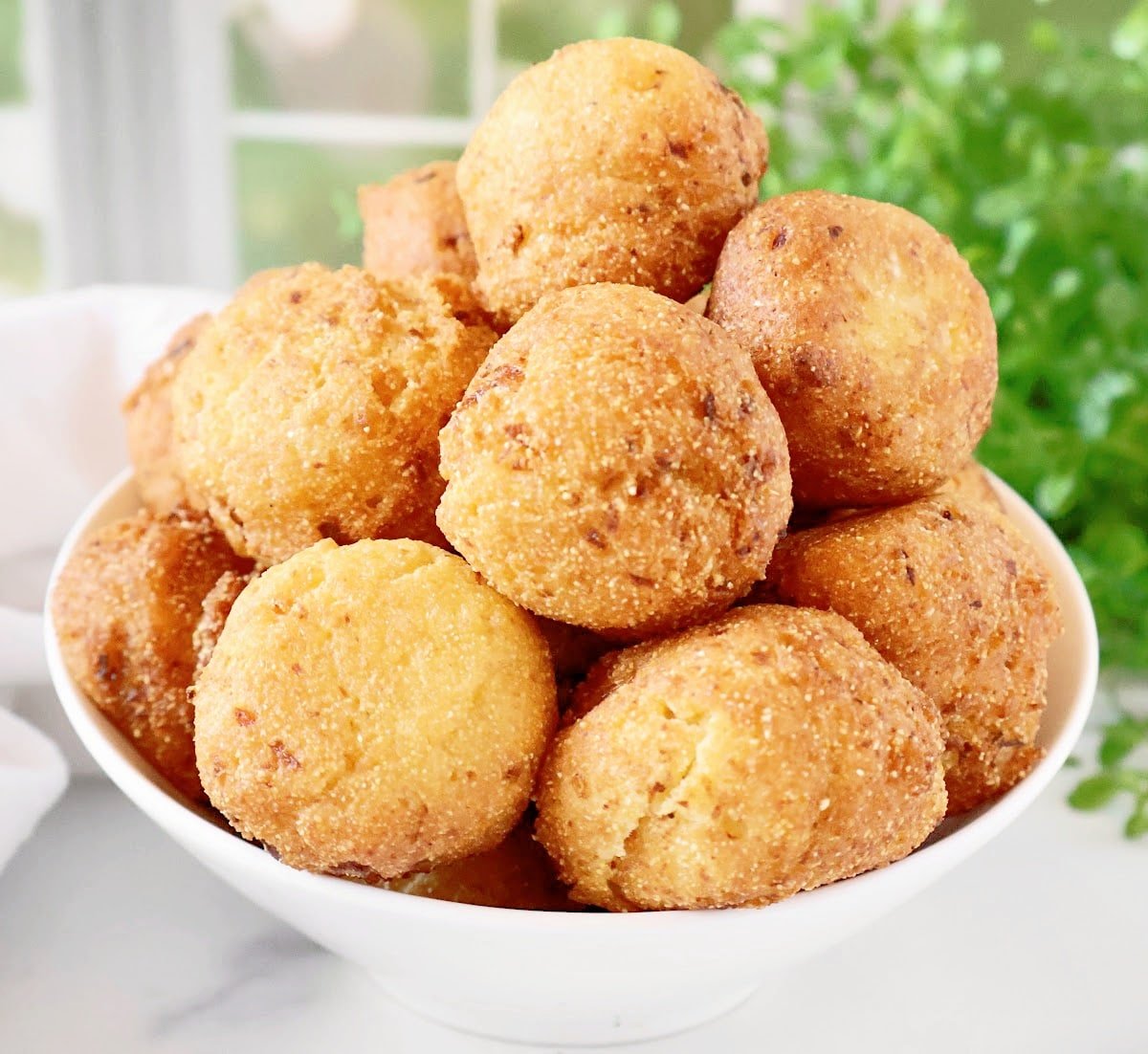 Golden vegan hush puppies! Made with plant-based ingredients and bursting with Southern flavor, these crispy cornbread rounds are perfect for any occasion.