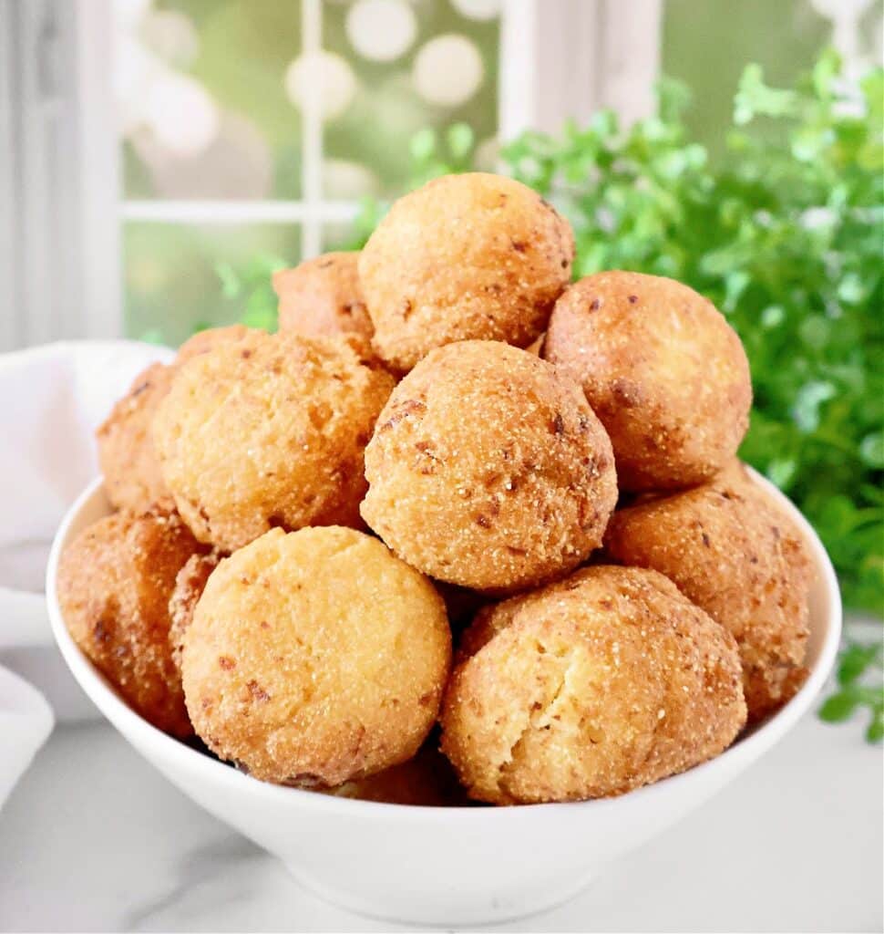 Golden vegan hush puppies! Made with plant-based ingredients and bursting with Southern flavor, these crispy cornbread rounds are perfect for any occasion.