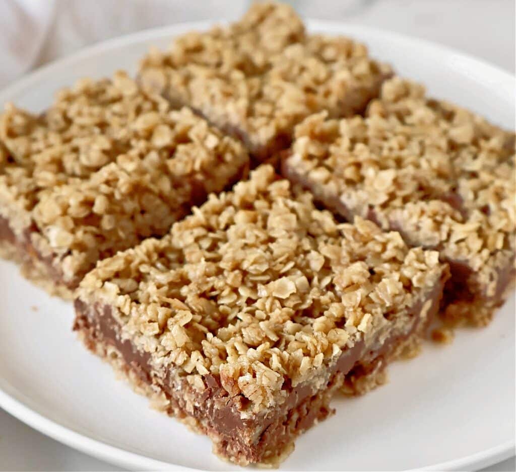 Peanut Butter Chocolate Oatmeal Bars ~ Sweet treat that's super easy to make with a buttery oatmeal base, layer of rich chocolate and peanut butter, and a crumbly oatmeal topping.