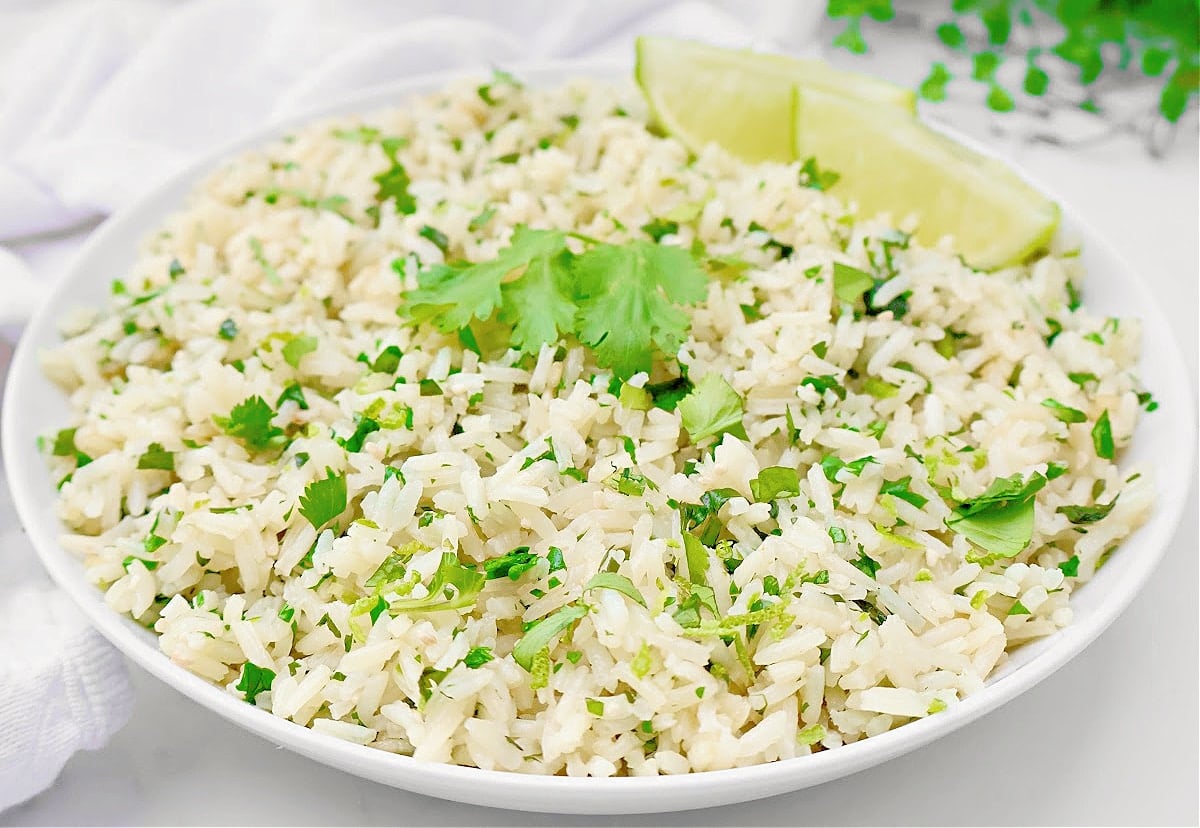 Cilantro Lime Rice ~ Simple and subtle fluffy rice infused with cilantro and lime. Pairs well with Mexican and Indian cuisines.