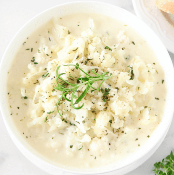 Cauliflower Soup with Fresh Herbs ~ Rich and creamy cauliflower soup with satisfying bites of cauliflower and aromatic garden-fresh herbs.
