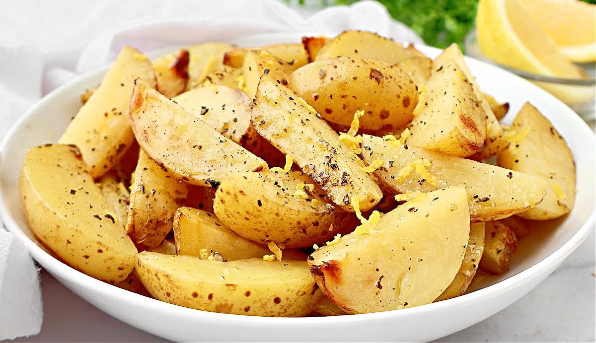 Lemon Roasted Potatoes ~ Crisp golden potatoes with a tangy blend of fresh lemon and savory fresh herbs. Easy side dish for Easter brunch!